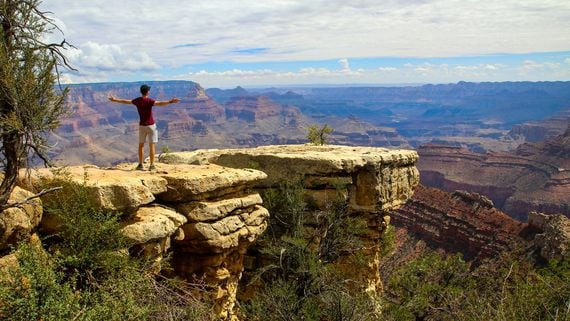 man overlooking Grand Canyon