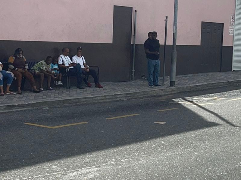 People waiting at a bus stand in the downtown area of Nassau, The Bahamas (Amitoj Singh/CoinDesk)