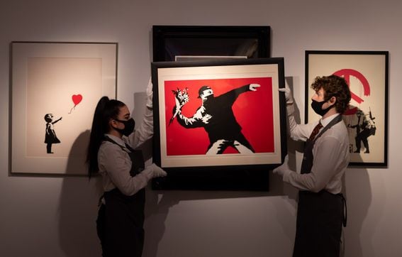 "Love is in the Air" by Banksy displayed in London in March.