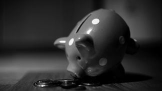 CDCROP: Piggy bank bent forward change money coins (Andre Taissin/Unsplash, modified by CoinDesk)
