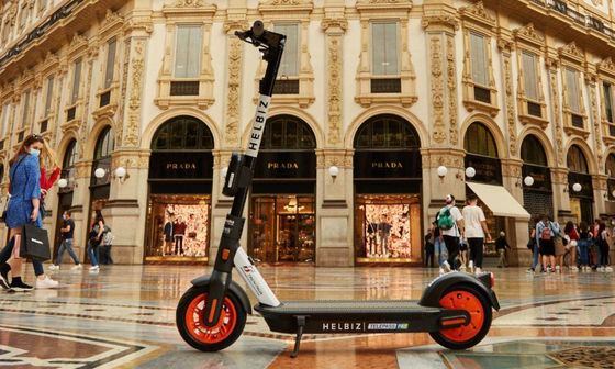 Helbiz e-scooter in front of a shopping center in Milan, Italy (Helbiz)